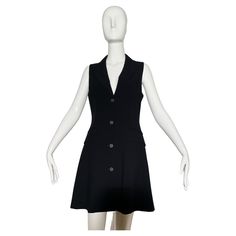 Black sleeveless blazer dress. Vest style. Lapel. Front pockets. Button closures. Lined. Wool. Made in Italy. *Condition: excellent vintage condition. No visible flaws. Measurements Taken Laying Flat (inches)— Shoulder to Shoulder: 13 in. Bust: 32 in. Waist: 30 in. Hip: 34 in. Length: 37 in. Marked size: 40 IT, 6 US— best fit for a 4/6 Black Sleeveless Blazer, Sleeveless Blazer Dress, Evening Dress Black, Claude Montana, Dress Vest, Sleeveless Blazer, Vest Style, Vest Fashion, Blazer Dress