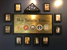 we salute you plaque on the wall with many photos