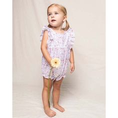 This darling romper with sweet ruffle hems and sleeves, and delicate pearl buttons, is reminiscent of the Victorian era. The sleepwear is made from the finest quality yarn-dyed cotton and blended with just enough inherently flame retardant fiber to allow it to pass strict CPSC flame retardant laws without using harmful chemicals. The fabric is brushed for added softness, making the sleepwear feel absolutely luxurious, getting cozier after each wash. Please enter the text exactly as you want it t Baby Ruffle Romper, Dorset Coast, Luxury Sleepwear, The Victorian Era, Pink Petals, Ruffle Romper, Flame Retardant, Gifted Kids, Kids Sleepwear