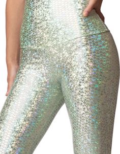 Our exclusive new color for our best-selling mermaid legging. These stunning icy mint green mini fish scales sparkle and shine with iridescence as you move. Pair with the matching crop for the head to toe look. MATERIAL 80% nylon/20% spandexhigh performance, quick-drying 4-way stretch fabrication molds to your body as you sweat and wicks away moistureseamless high waist band with option to be folded over SIZING XS: 0-2S: 2-6M: 6-10L: 10-14inseam on full length long legging is approximately 31" C Crystal Mermaid, Mermaid Bra, Mermaid Leggings, Sweaty Workouts, Flared Leggings, Long Leggings, Fish Scale, Fish Scales, Stretch Leggings