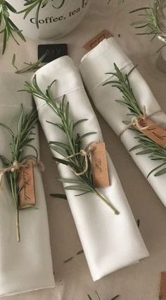 napkins wrapped in twine and tied with rosemary