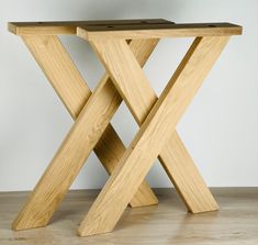 a wooden table sitting on top of a hard wood floor