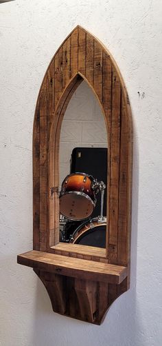 a wooden shelf with a guitar on it