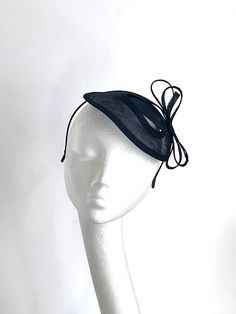 Black fascinator hat This lovely black fascinator Hat is made inspired by coming races. Black fascinator Hat will be an amazing accessory to compliment your outfit. Black fascinator hat will fit an average head size. Its made from fabric covered metal headband attached to the black sinamay saucer base on which sits black bow. Black fascinator hat is very simple and elegant. Its very light on your head. This amazing hat will be a wonderful accessory to compliment your outfit for the Kentucky Derb Black Fitted Fascinator For Party, Fitted Black Fascinator For Party, Black Fitted Fascinator For Evening, Fitted Black Fascinator For Evening, Black Hat-style Headpieces For Wedding, Black Hat Headpiece For Wedding, Black Hat Style Headpieces For Wedding, Black Mini Hat For Kentucky Derby Wedding, Fitted Black Hat For Royal Ascot