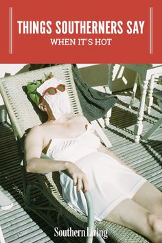 a woman laying on top of a chair next to a white towel and red sign