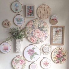 the wall is covered with many different types of embroiderys and flowers, including roses