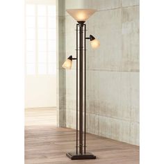 a floor lamp with three lights on it