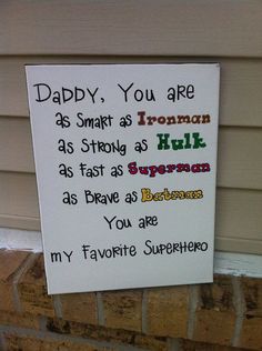 a sign that is posted on the side of a building saying daddy, you are as smart as iron man as hulk