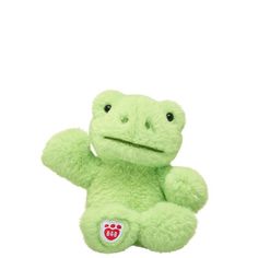 a green frog stuffed animal on a white background