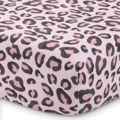 Our 3-Piece baby crib bedding set for boys and/or girls includes one crib quilt, one fitted crib sheet, and one crib skirt. The crib quilt features a printed center panel with an updated classic of all-over leopard print in shades of pink and black, pieced with a large pink border and leopard print binding. The fitted crib sheet matches the playful quilt center print, while the dust ruffle has layers of ruffled pink chiffon. All in soft microfiber for comfort and easy care. Pink And Gray Jungle Nursery Bedding, Pink Boho Crib Bedding, Blush Crib Bedding Set, Pastel Pink And Gray Leopard Minky Fabric, Cat Crib Bedding, Crib Bed Sets, Crib Comforter, Baby Crib Bedding Sets, Pink Border