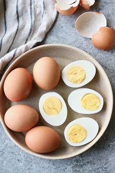 six eggs in a bowl on a table