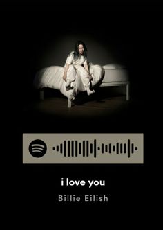 a woman sitting on top of a bed in front of a sound board with the words i love you