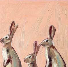 three rabbits standing next to each other on a pink background