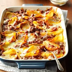 a casserole dish with meat and cheese on it, ready to be eaten