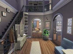 an image of a living room with stairs leading to the upper floor and second story