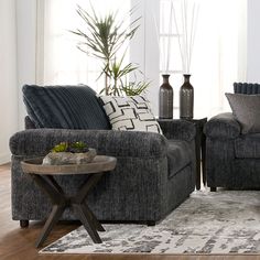 a living room with two couches and a coffee table