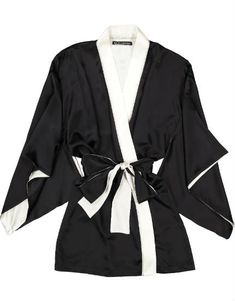 The luxurious black silk satin kimono by Helen Sanchez has full sleeves, a long sash belt and is trimmed with ivory silk. - Approximately 31" from shoulder to hem - 95% silk, 5% Lycra - Made in New York Elegant Formal White Kimono, Silk Evening Kimono With Kimono Sleeves, Chic Black Kimono For Party, Elegant Black Silk Robe, Elegant Black Satin Robe, Elegant Satin Finish Kimono For Party, Black Silk Evening Kimono, Chic Satin Wrap Kimono, Formal Elegant Silk Kimono