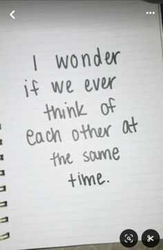 a notepad with the words i wonder if we ever think of each other at the same time