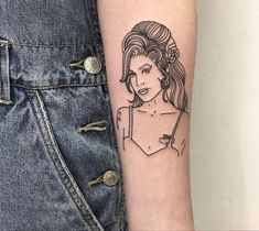 a woman's arm with a tattoo on it and an image of her face