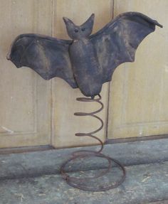 a metal bat hanging from the side of a door