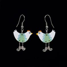 You will love these funny chicken earrings because they will make you feel special on any day you choose to wear them! These little chick earrings will add a dose of cheer to your choice of accessory. Custom crafted and hand painted to perfection. The handpainted birdies are set in enameled stainless steel base. Handcrafted with an eclectic combination of techniques. Product specifications: Materials: stainless steel, stainless steel wire, beads Width is about 0.8 inches (2 cm) Quantity: 1 pair Kindergarten Teacher Gift, Chicken Earrings, Shrinky Dink Jewelry, Kindergarten Teacher Gifts, Earrings Funny, Wire Beads, Funny Jewelry, Funny Earrings, Quirky Earrings