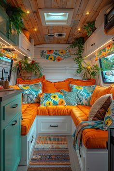 the interior of a camper with orange and blue decor