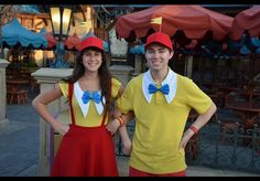 two people dressed in costumes standing next to each other