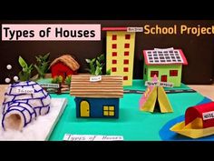 some paper houses are on a table with other things in the background and text that reads types of houses school project