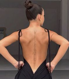 a woman with her back turned to the camera