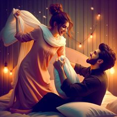 a man and woman are sitting on a bed with lights in the room behind them