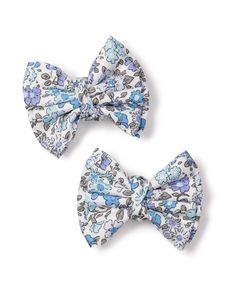 Our girls' hair bows add the same panache as our pajamas, yet in a fun-sized package! **Please note, the hair bows cannot be returned.** Measurements: Large bow: 6.5" length x 6" width Medium bow: 4" length x 3" width Baby bow : 3.5" length x 2.5" width Small bow 2 pack: 3" length x 2.5" width Playful Adjustable Bow For Spring, Blue Hair Accessories With Matching Headband For Spring, Playful White Decorative Bow, Blue Adjustable Bow Hair Accessories, Adjustable Blue Bow Hair Accessories, Cute Spring Bow Tie Hair Accessories, Cute Blue Hair Accessories For Summer, Cute Blue Hair Accessories With Headband, Cute Blue Summer Hair Accessories