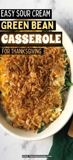 a white bowl filled with green bean casserole on top of a marble counter