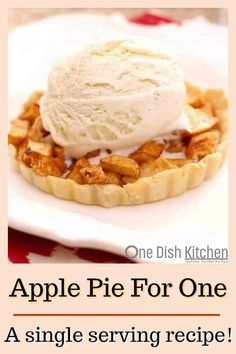 an apple pie for one is served on a white plate with a scoop of ice cream