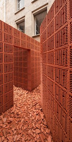 an outdoor area with red bricks on the ground