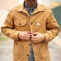 Railcar Unisex Canvas Chore Coat. This has been a staple in our line for about 3 years now and it is still a timeless piece. Made from 12 ounce American Duck Canvas. Solid triple needle construction and all American hardware.   This was designed, cut, and sewn in our workshop located in Monrovia, CA. Rugged Cotton Outerwear With Buttons, Rugged Cotton Outerwear With Snap Buttons, Chore Coat, Americana Fashion, Duck Canvas, Raincoats For Women, Selvedge Denim, Mens Style, Western Shirts