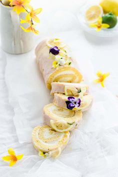 slices of bread with flowers and lemons on the side