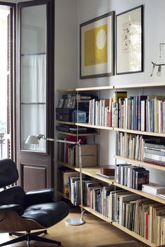 a chair and bookshelf in a room