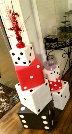 a stack of gift boxes sitting on top of each other in front of a door