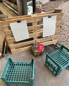 two wooden pallets sitting next to each other on the ground