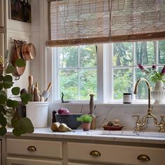 a kitchen counter with pots, pans and utensils sitting on top of it