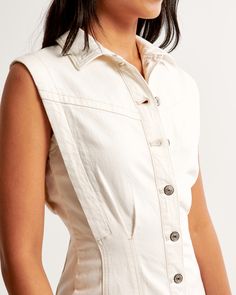 Elevate your wardrobe with the chic and timeless Women's Collared Denim Shirt Dress from Abercrombie & Fitch. This cream-colored dress combines elegance with casual comfort, making it a versatile addition to any fashion-forward collection.

- Size: XL TALL
- Color: Cream
- Material: Cotton, Polyester, Elastane
- Gender: Female
- Age Group: Adult
- Features: Slim fit, fully functional button-through front, flattering seaming details

Crafted in a soft and stretchy denim blend, this dress ensures Chic Cotton Denim Dress With Button Closure, Chic Denim Dress With Button Closure, Casual Cotton Denim Dress For Work, Fitted Denim Dress With Buttoned Pockets For Day Out, Button-up Denim Dress For Workwear, Fitted Button-up Denim Dress For Work, Chic Cotton Denim Dress With Buttons, Collared Denim Dress With Button Closure, Chic Washed Cotton Denim Dress