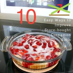 a glass pie dish filled with cranberry sauce on top of a black stove