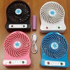 four different types of fan sitting on top of a table