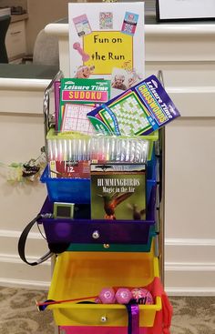 an assortment of school supplies sitting on top of a cart