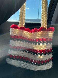 a handbag is sitting on the back seat of a car