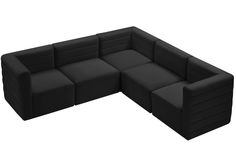 a large black couch sitting on top of a white floor