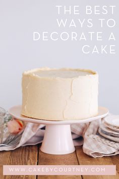 the best ways to decorate a cake on a wooden table with flowers and napkins