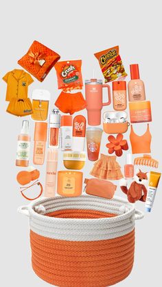 an orange and white basket filled with lots of items