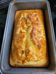 a loaf of bread sitting on top of a metal pan