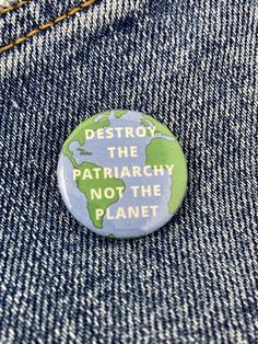 a button that says destroy the patriachy not the planet on it's back